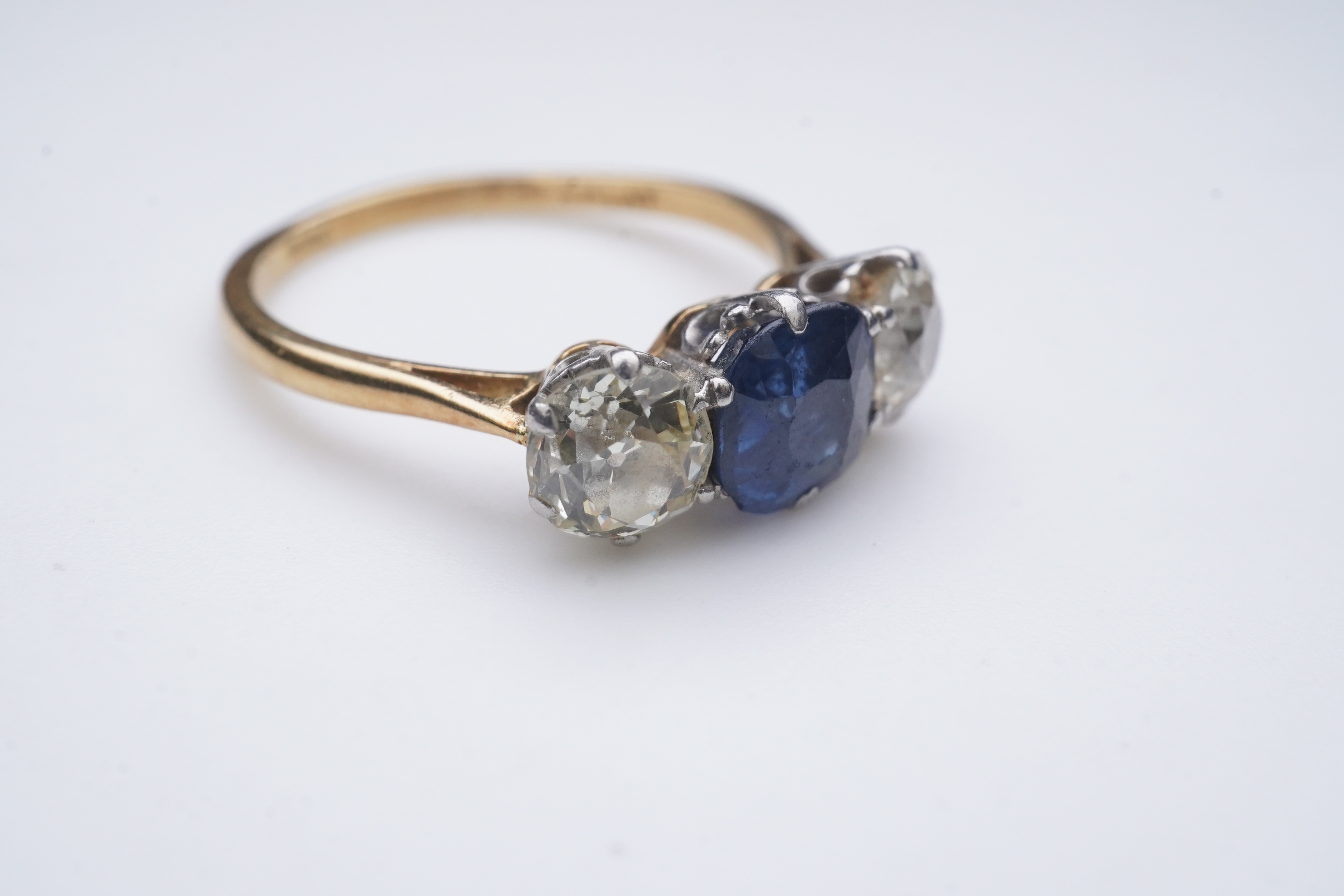 A sapphire and diamond three-stone ring, early 20th century